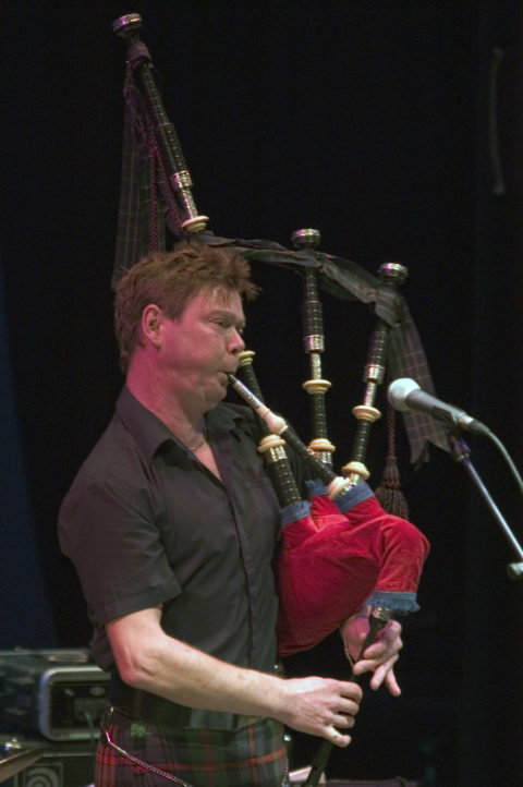 Photo of Gordon playing the pipes